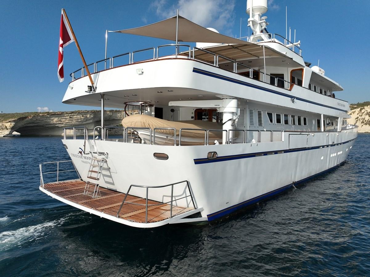a large white boat on the water aboard CHEETAH MOON Yacht for Sale