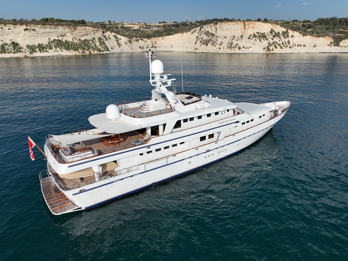a white boat on water aboard CHEETAH MOON Yacht for Sale
