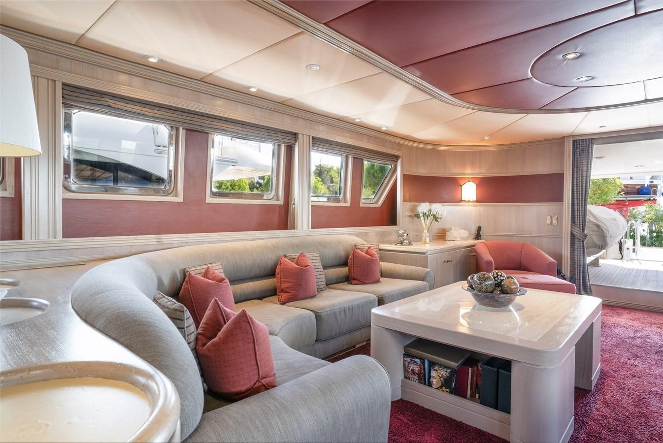 a living room with a couch and a table aboard CHEETAH MOON Yacht for Sale