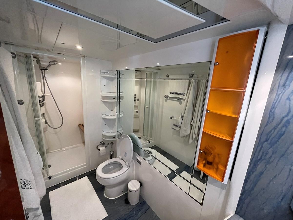 a bathroom with a glass shower aboard AZIMUT 85 Yacht for Sale