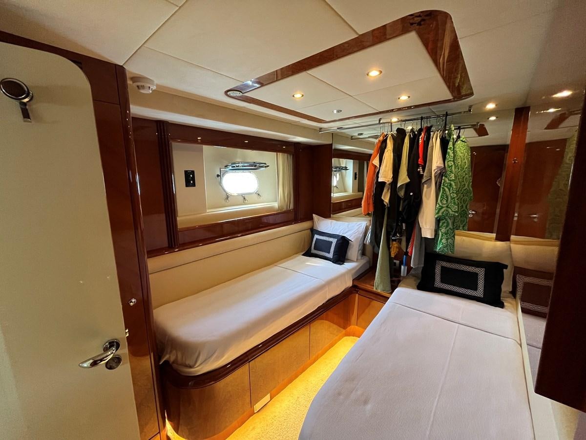 a room with a bed and a desk aboard AZIMUT 85 Yacht for Sale