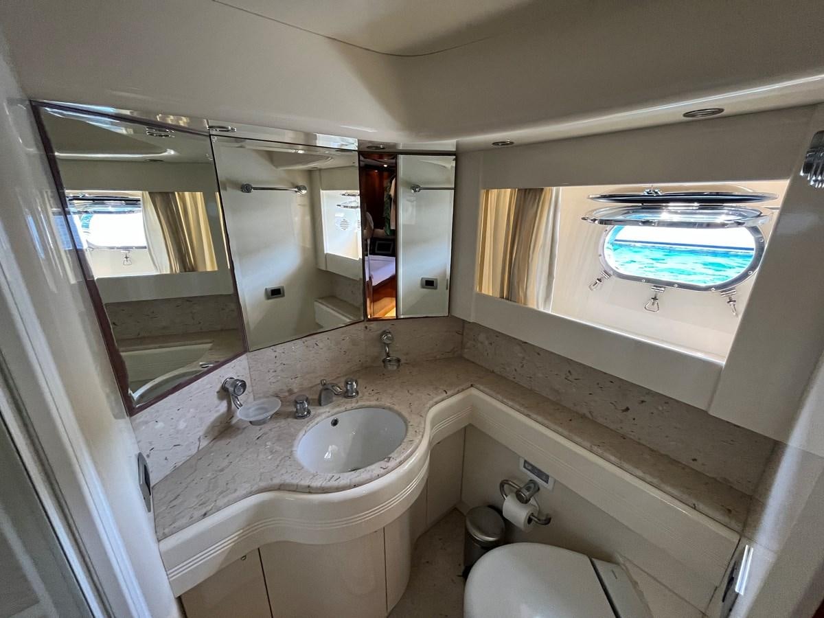 a bathroom with a large mirror aboard AZIMUT 85 Yacht for Sale