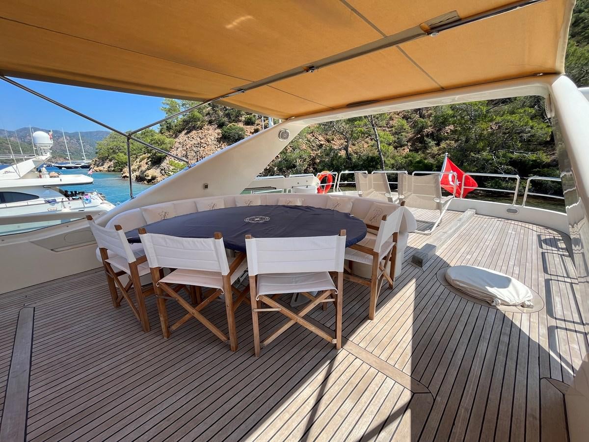 a table set up on a deck aboard AZIMUT 85 Yacht for Sale