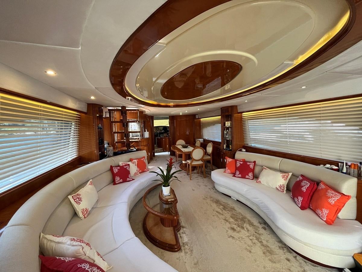 a large living room with a large chandelier aboard AZIMUT 85 Yacht for Sale