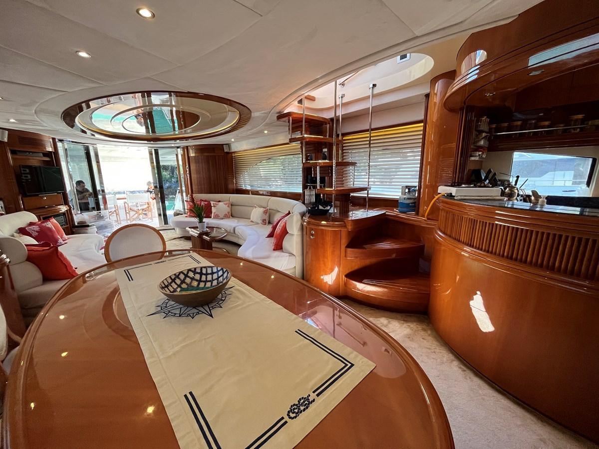 a large living room with a large window aboard AZIMUT 85 Yacht for Sale