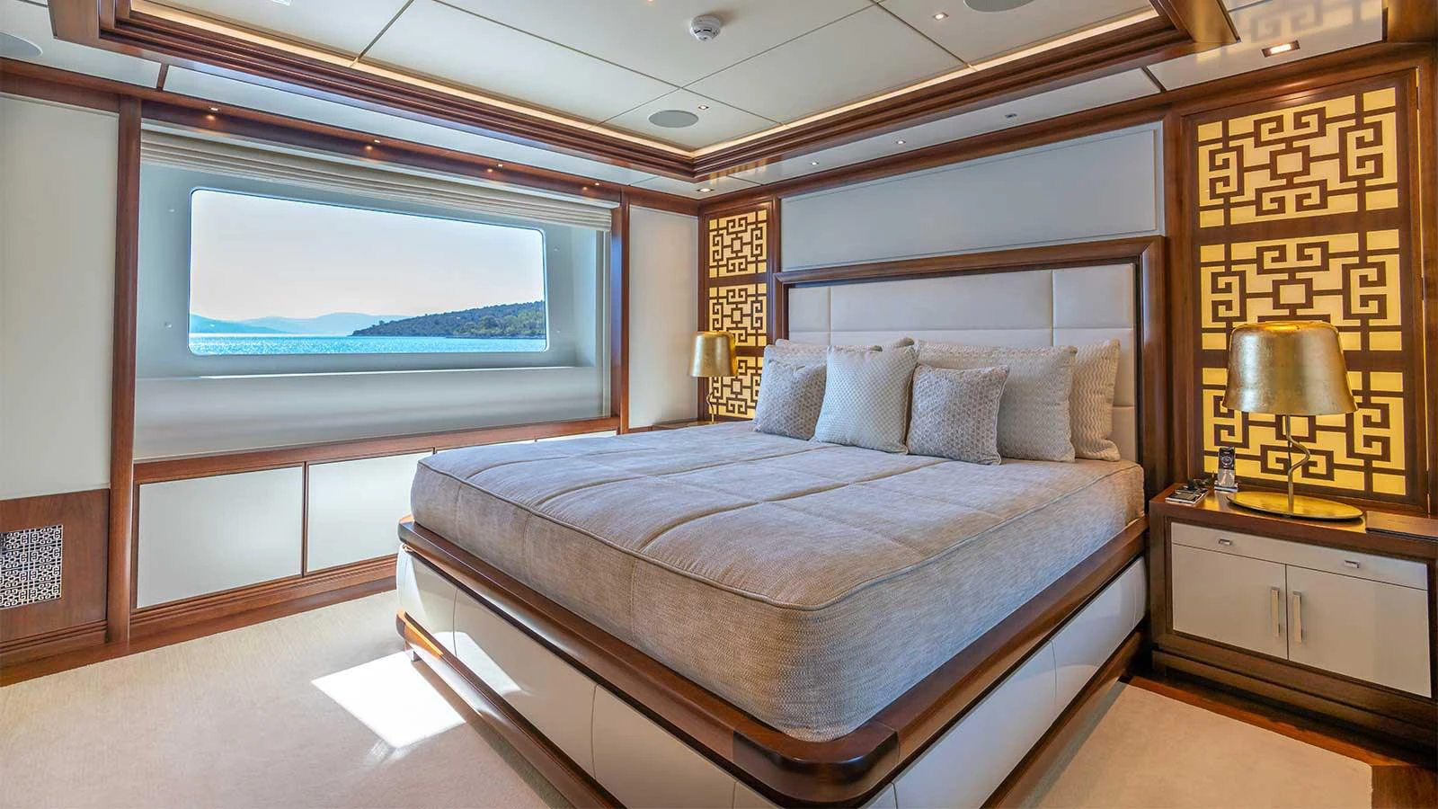 a bed in a room aboard ILERIA Yacht for Sale