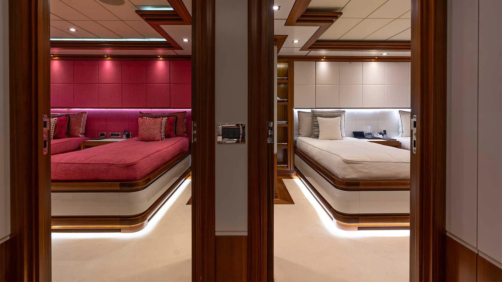 a room with a bed and a mirror aboard ILERIA Yacht for Sale