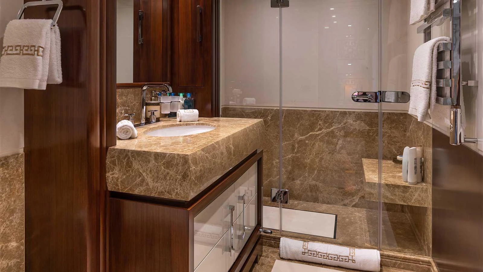 a bathroom with a countertop sink and a mirror aboard ILERIA Yacht for Sale