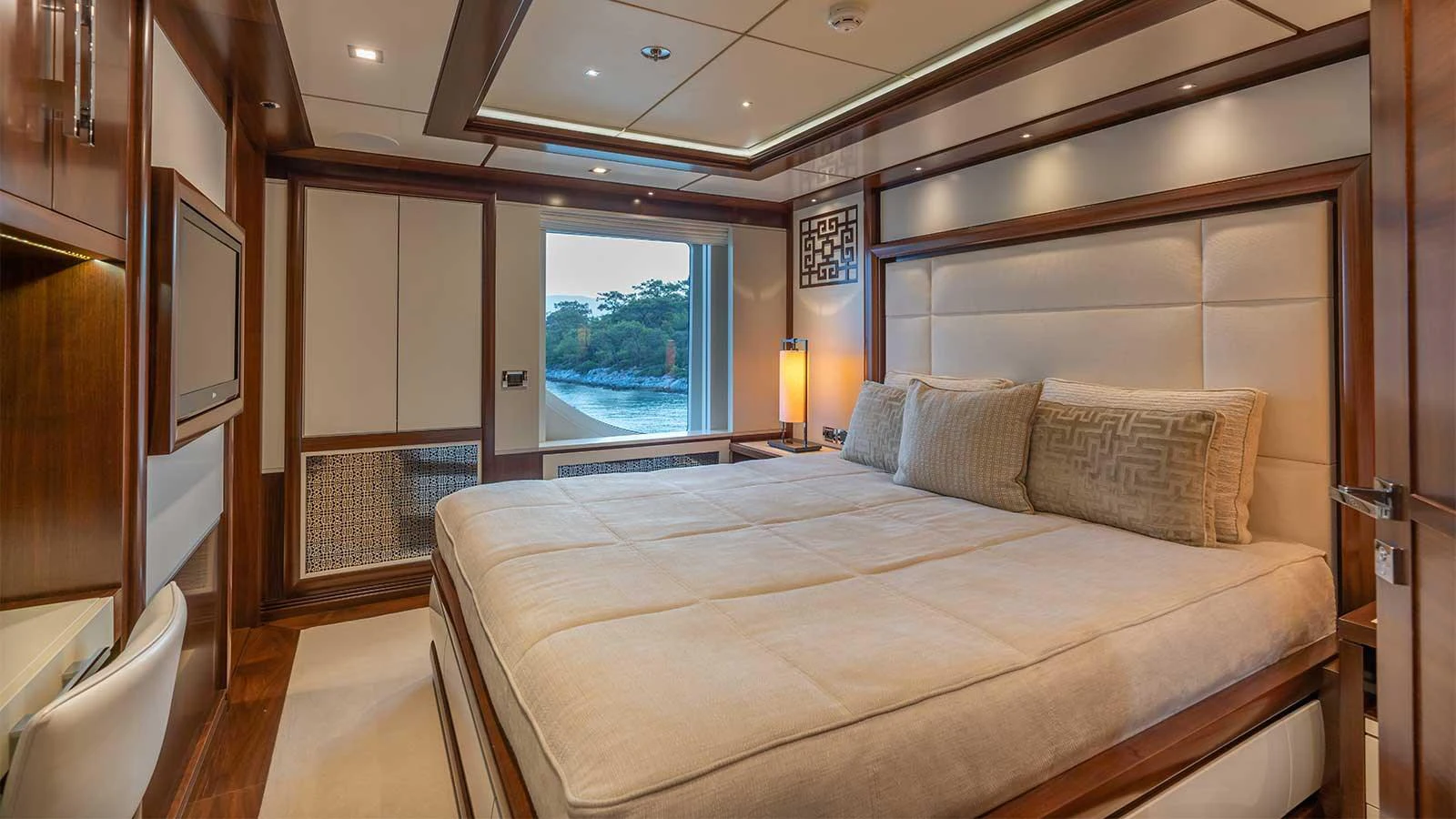 a bed in a room aboard ILERIA Yacht for Sale