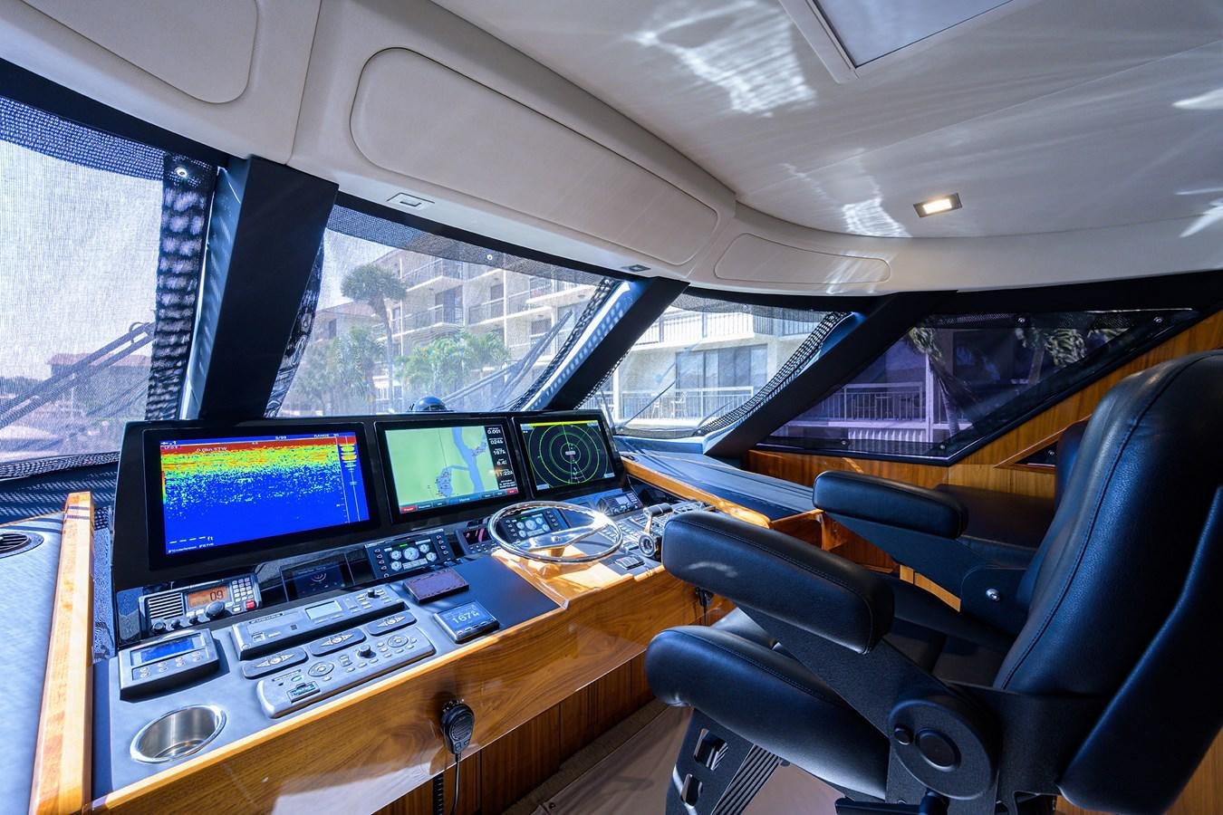 a vehicle with computers and monitors aboard ENCLOSED BRIDGE Yacht for Sale