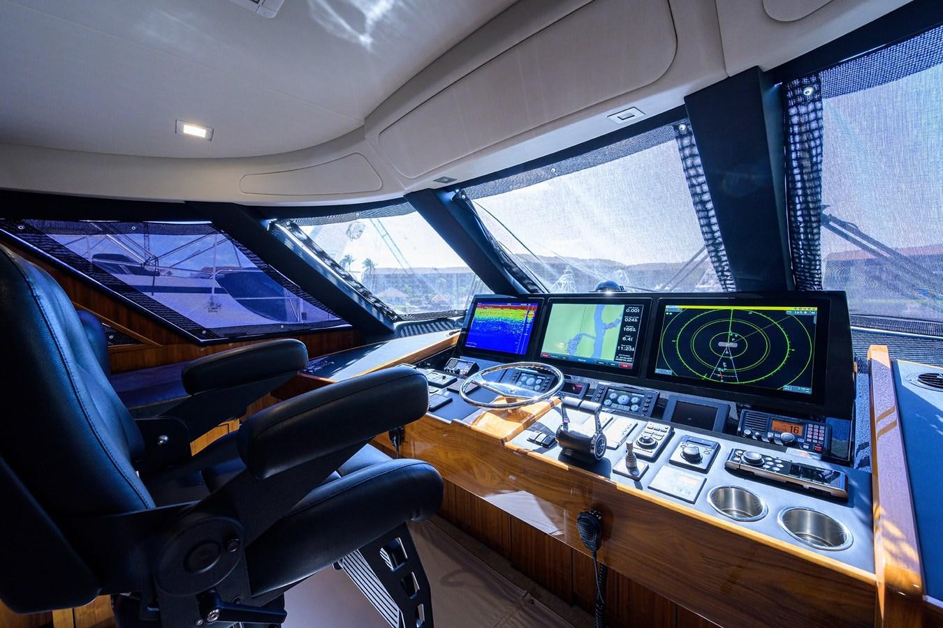 inside of a vehicle with computers aboard ENCLOSED BRIDGE Yacht for Sale
