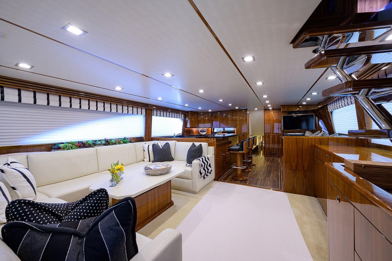 a living room with a large window aboard ENCLOSED BRIDGE Yacht for Sale