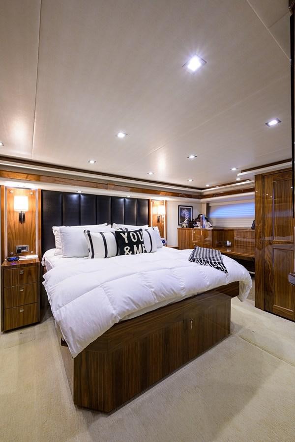a large bedroom with a large bed aboard ENCLOSED BRIDGE Yacht for Sale