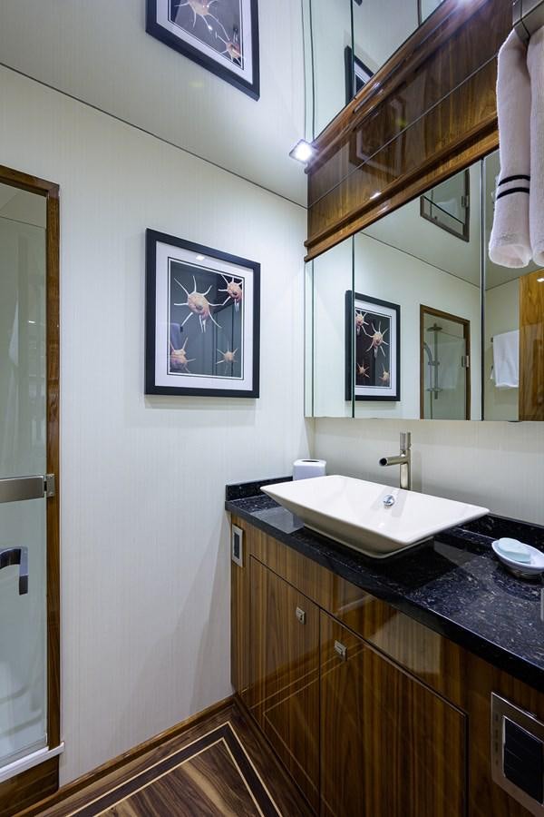 a bathroom with a sink and a mirror aboard ENCLOSED BRIDGE Yacht for Sale