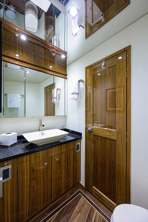 a bathroom with a glass shower door aboard ENCLOSED BRIDGE Yacht for Sale