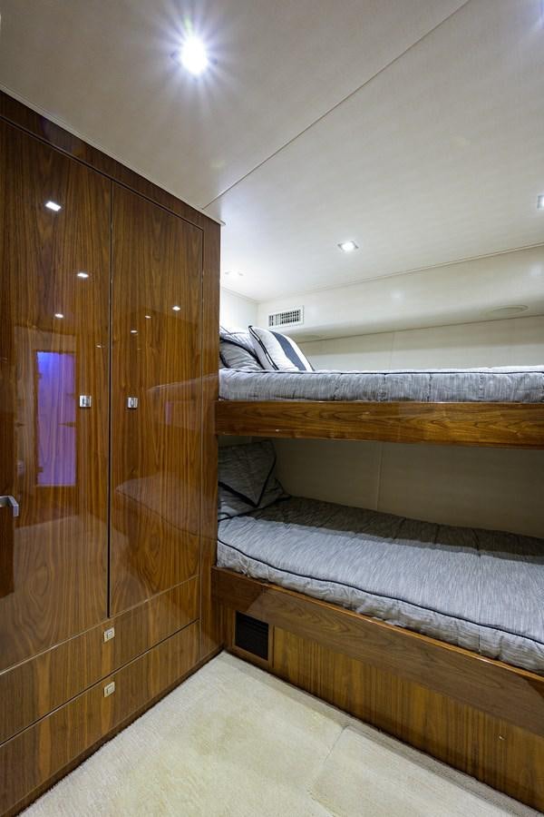 a room with wooden cabinets aboard ENCLOSED BRIDGE Yacht for Sale