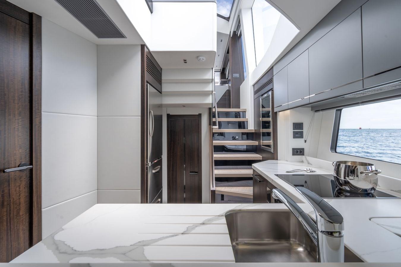 a modern looking kitchen aboard PREDATOR 74 XPS Yacht for Sale