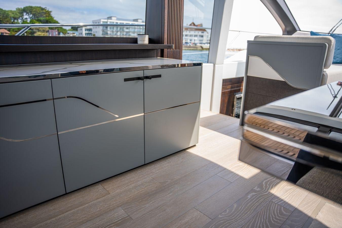 a room with a desk and a chair aboard PREDATOR 74 XPS Yacht for Sale