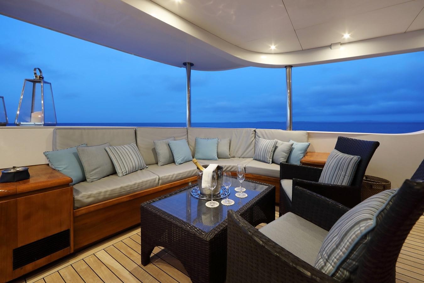 a living room with a large window aboard L'ALBATROS Yacht for Charter