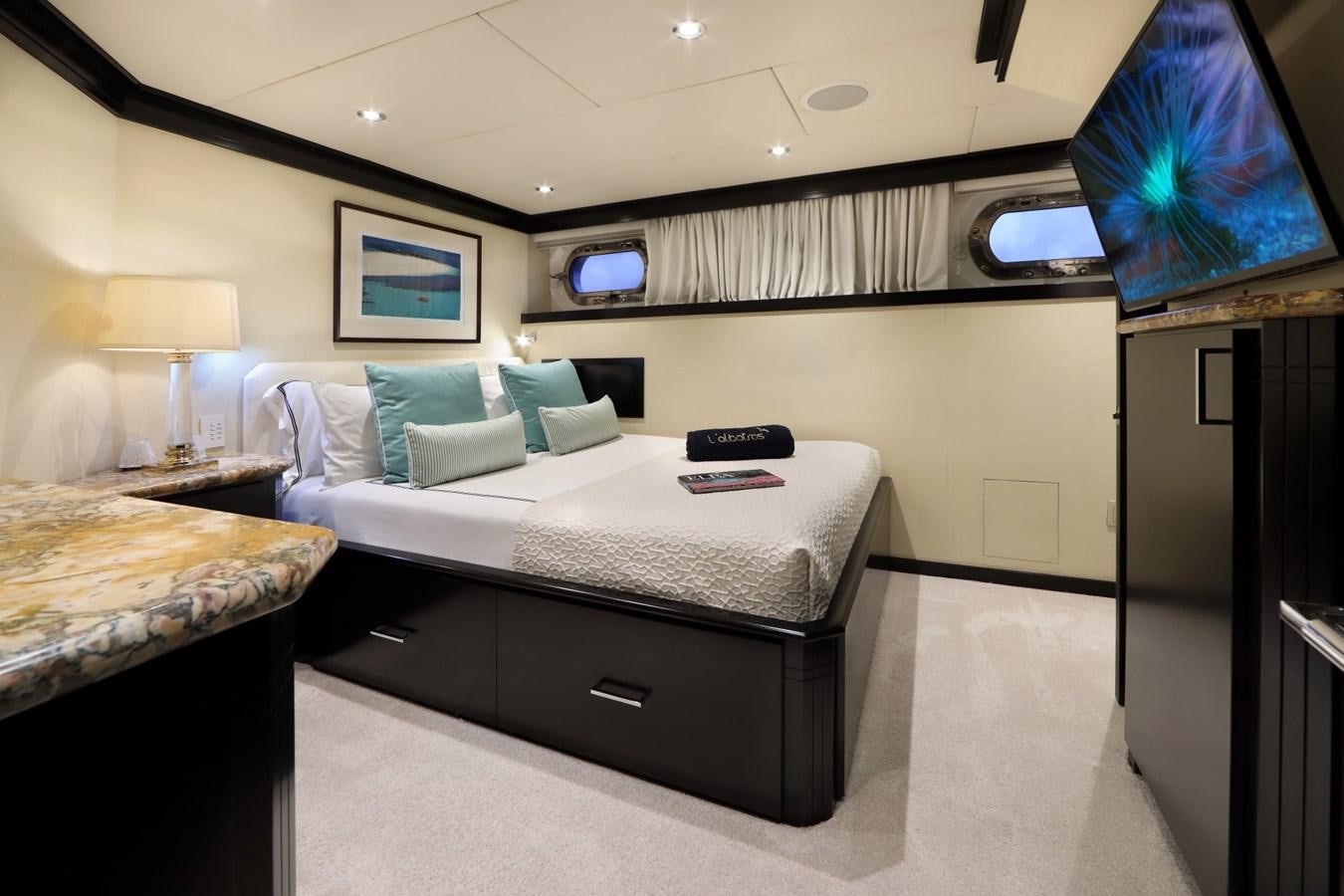 a room with two beds aboard L'ALBATROS Yacht for Charter