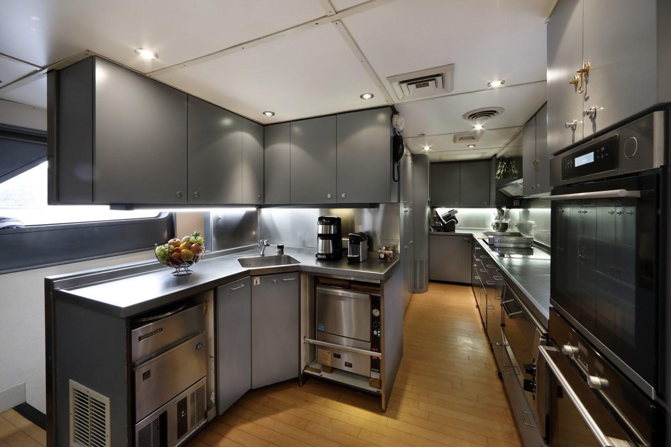 a kitchen with stainless steel appliances aboard L'ALBATROS Yacht for Charter