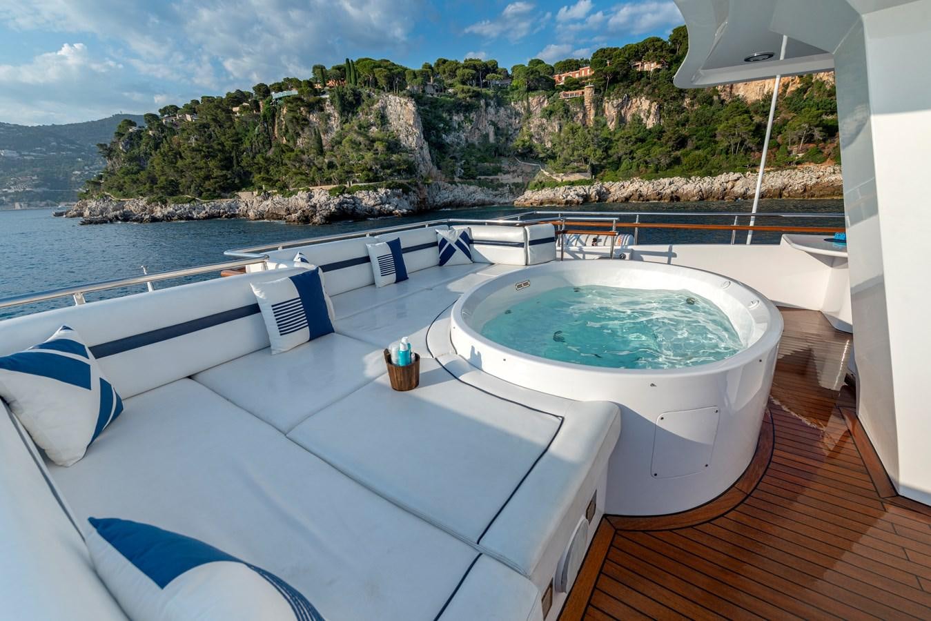 a swimming pool with a large white tub and a view of the ocean aboard L'ALBATROS Yacht for Sale
