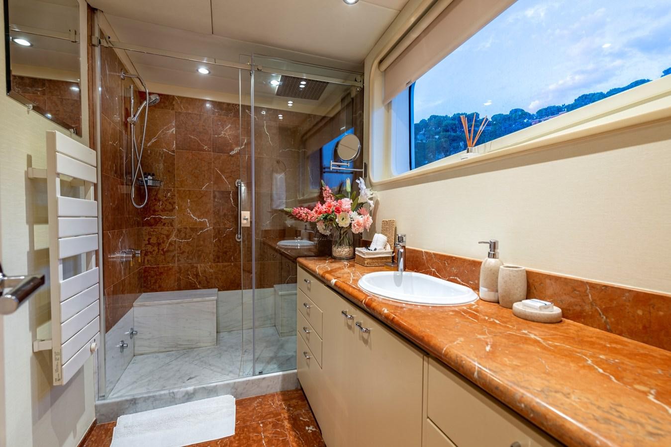 a bathroom with a shower and sink aboard L'ALBATROS Yacht for Sale