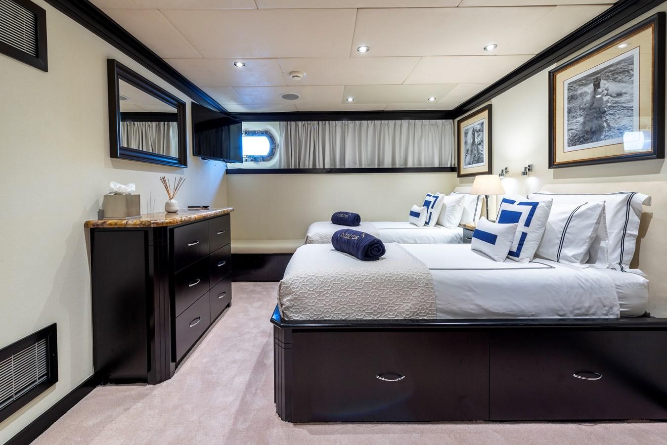 a room with a bed and a desk aboard L'ALBATROS Yacht for Sale