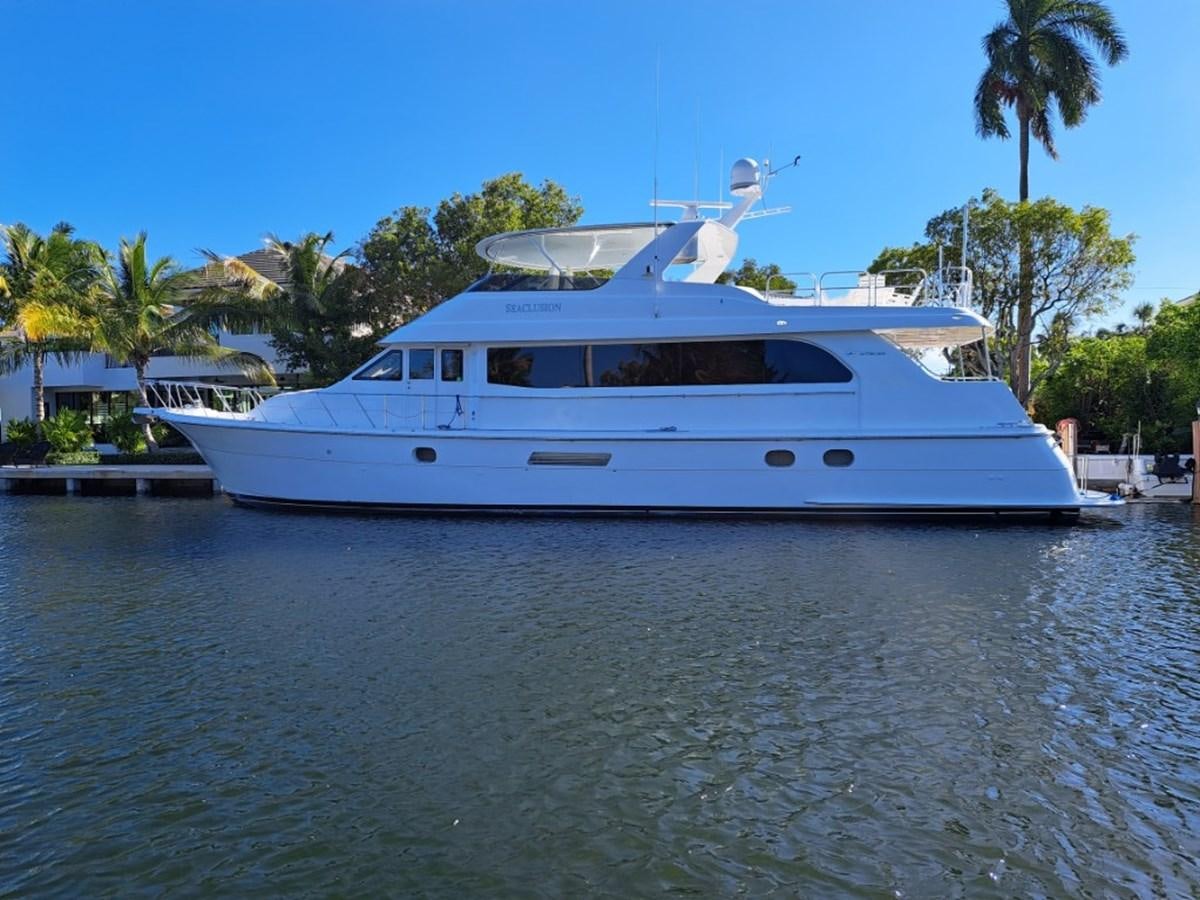 a white boat with a bird on it aboard SEACLUSION Yacht for Sale