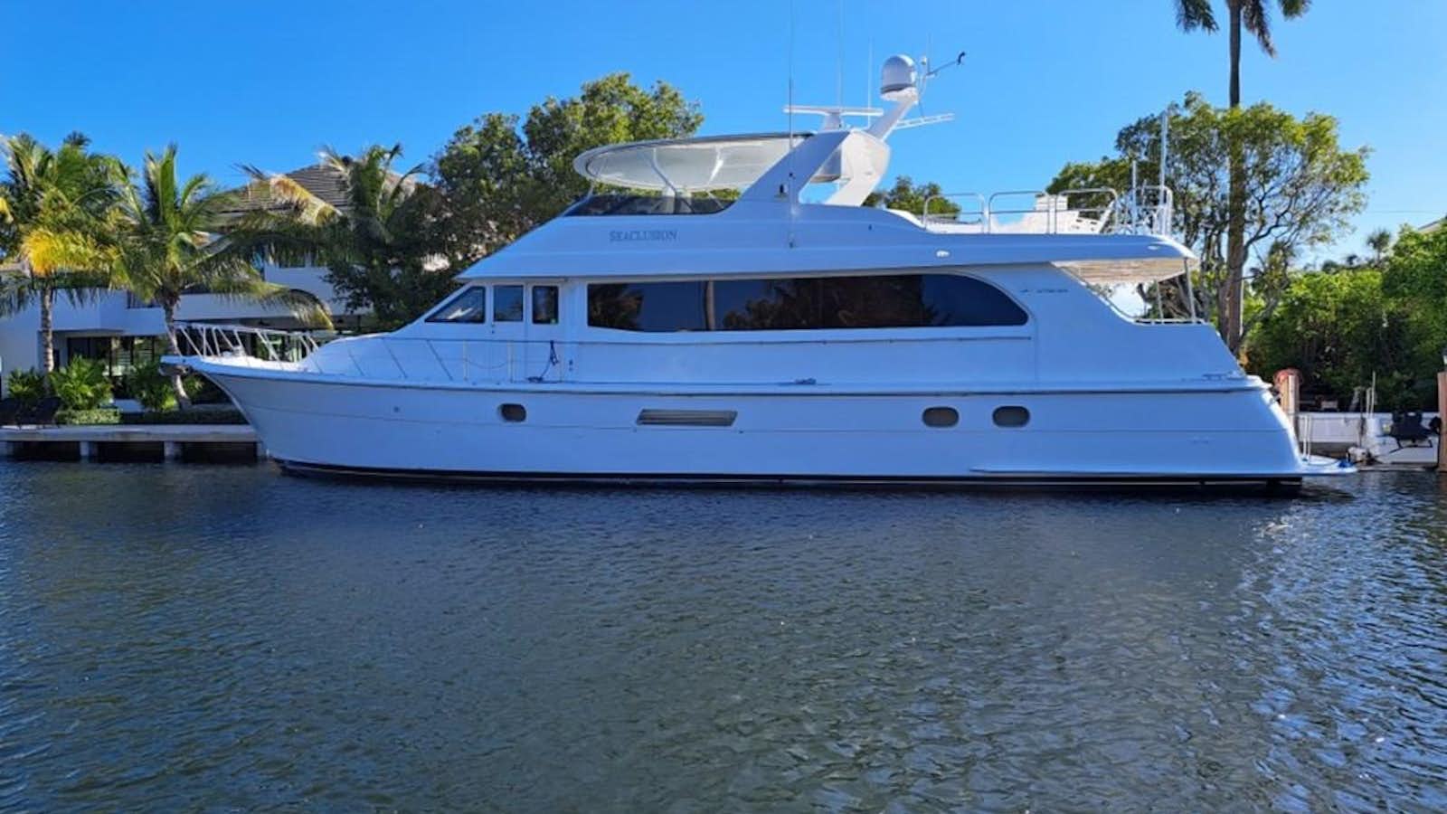 a white boat with a bird on it aboard SEACLUSION Yacht for Sale