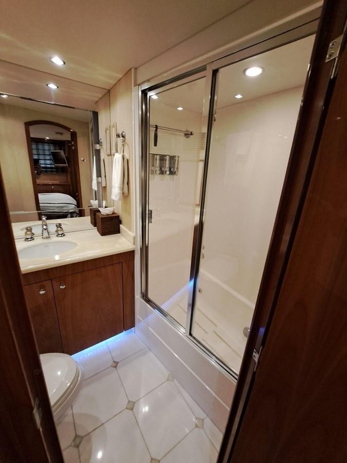 a bathroom with a glass shower aboard SEACLUSION Yacht for Sale