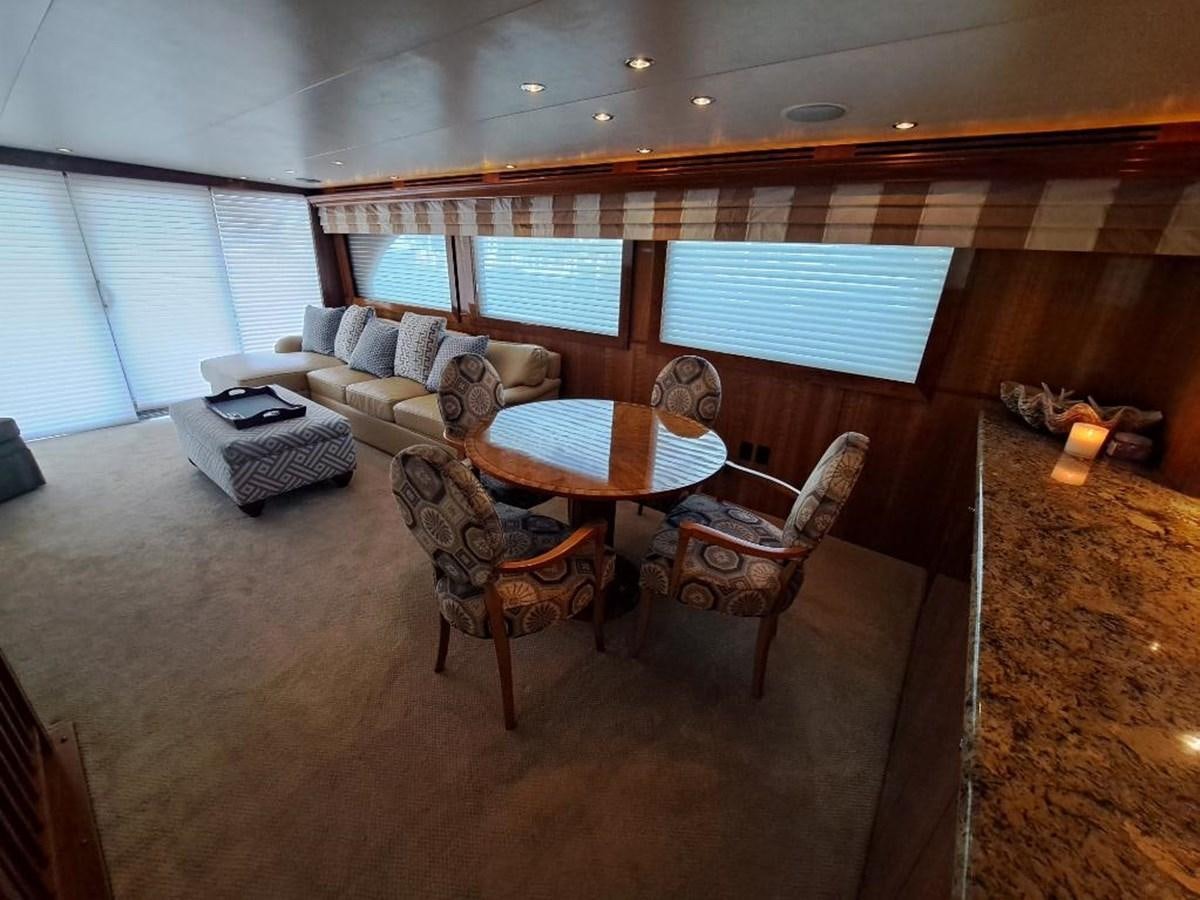 a living room with a couch and a table aboard SEACLUSION Yacht for Sale