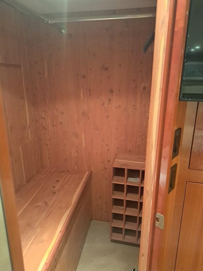 a wooden room with a wood door aboard SEACLUSION Yacht for Sale