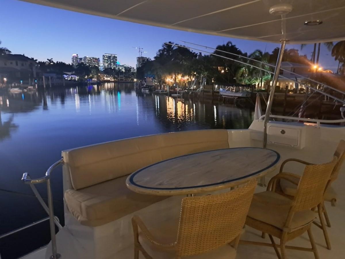 a table and chairs on a boat aboard SEACLUSION Yacht for Sale