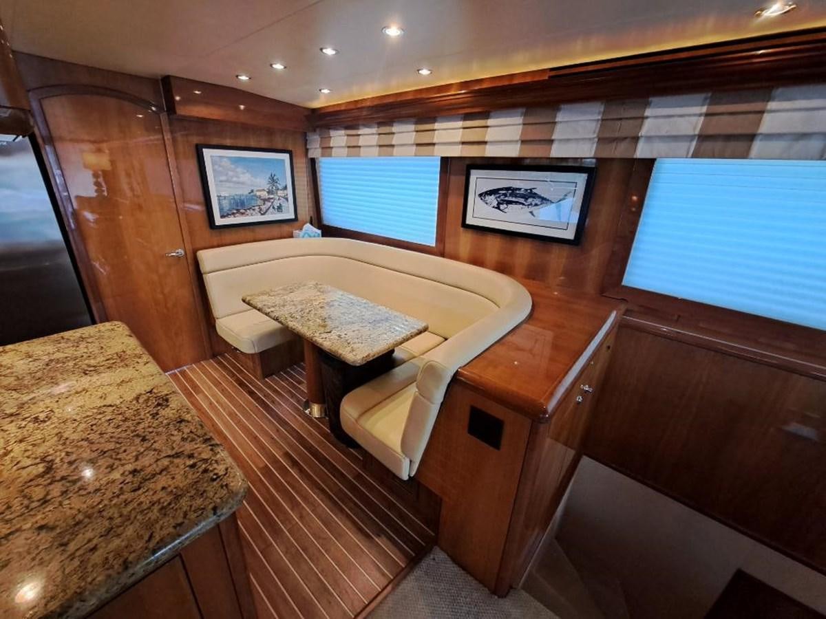a room with a table and chairs aboard SEACLUSION Yacht for Sale