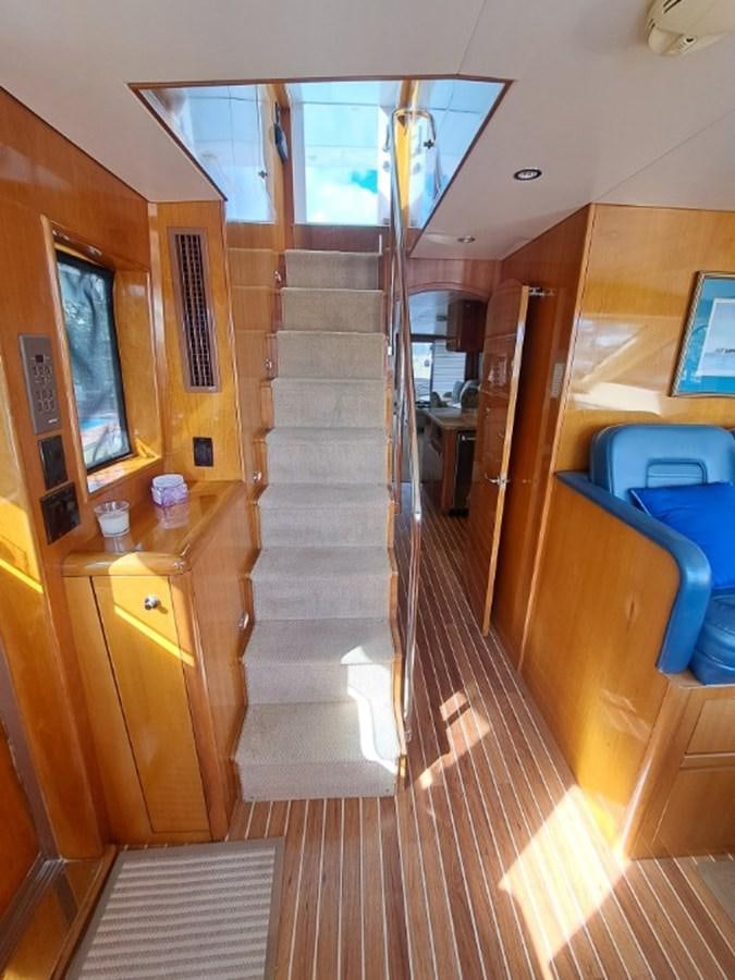 a wooden staircase in a room aboard SEACLUSION Yacht for Sale