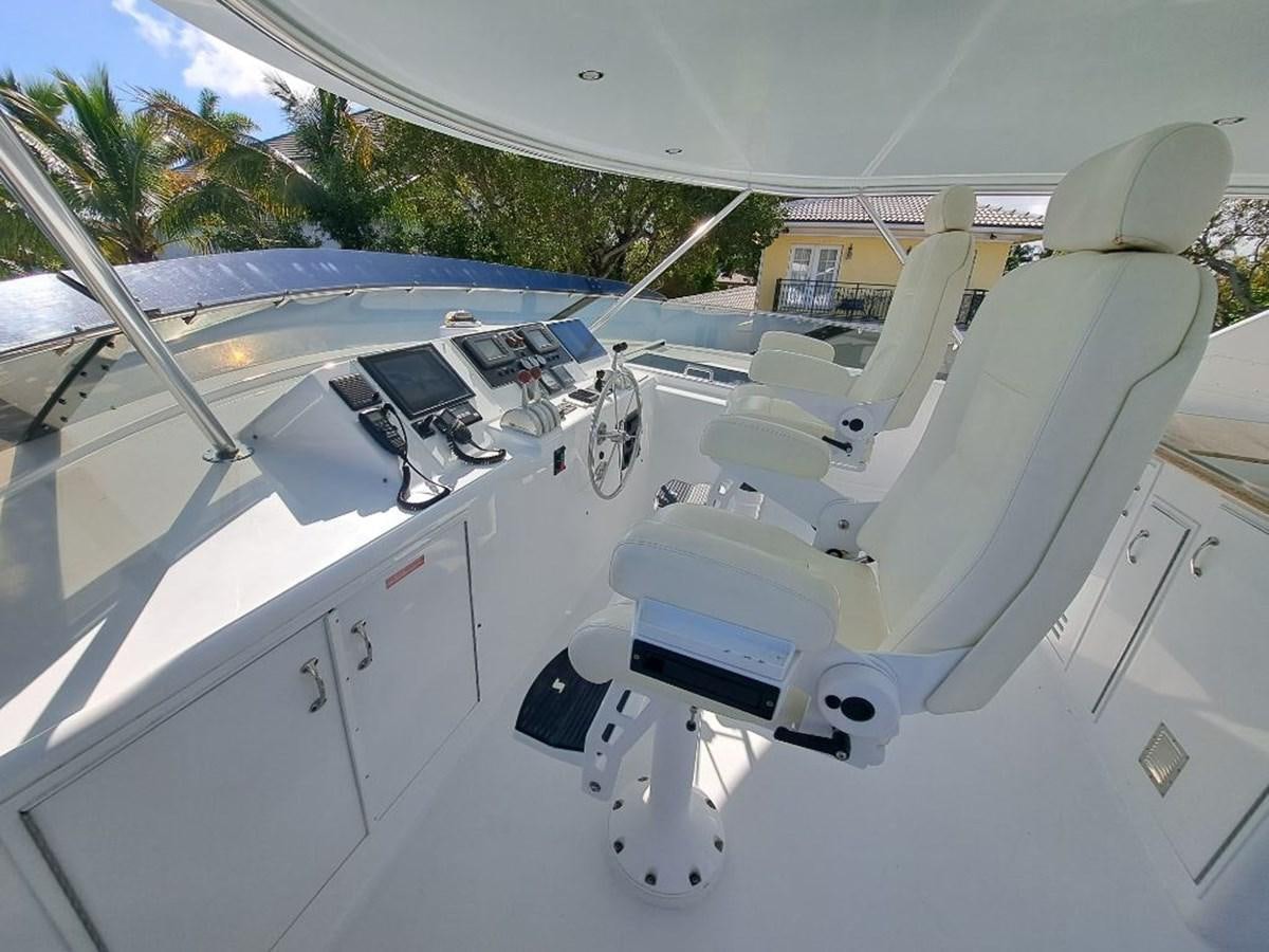 a white car with a black seat aboard SEACLUSION Yacht for Sale