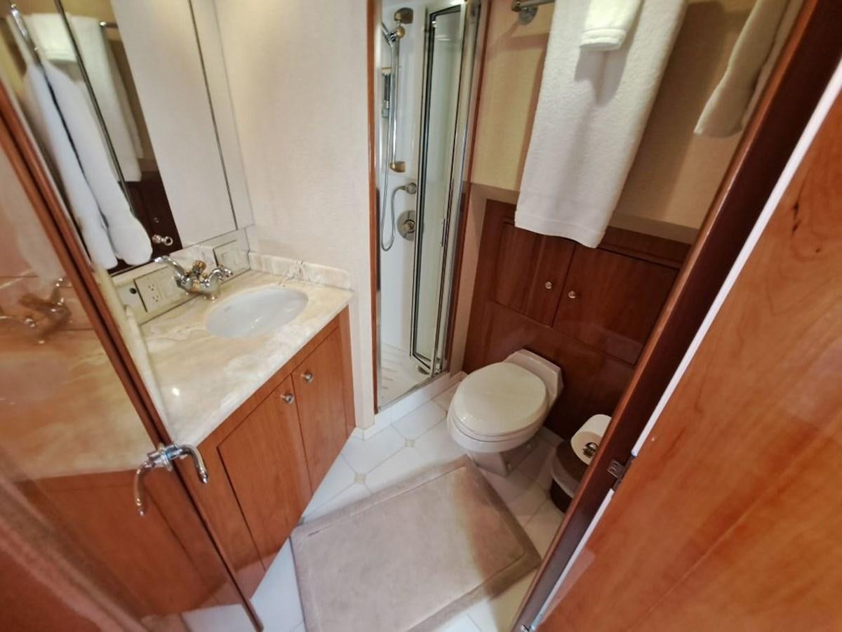 a bathroom with a sink and toilet aboard SEACLUSION Yacht for Sale