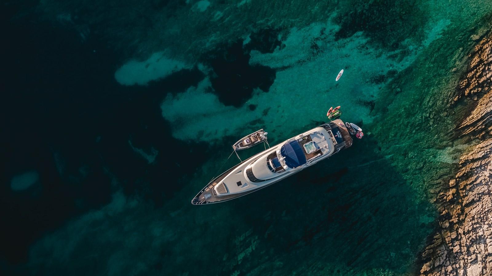 a group of people on a boat in the water aboard ONE BLUE Yacht for Sale