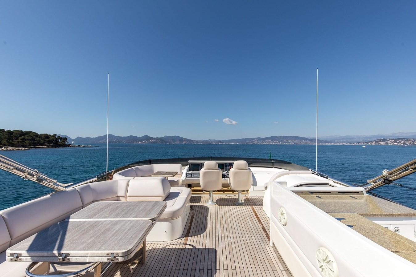 a deck with boats on it and water in the background aboard 2009 PRINCESS 85 Yacht for Sale