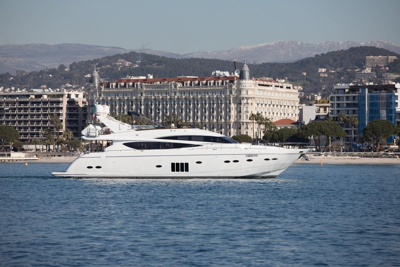 a white boat in the water aboard 2009 PRINCESS 85 Yacht for Sale