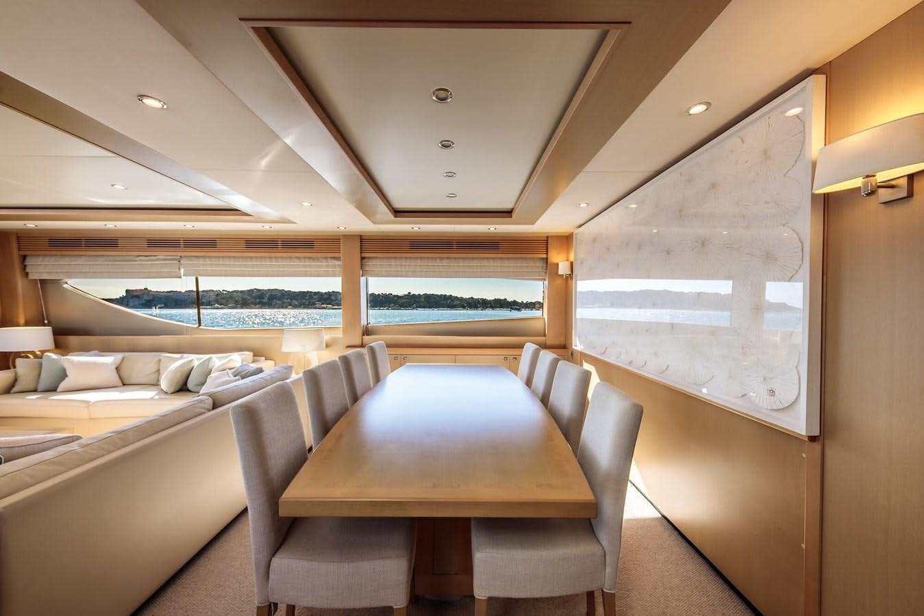 a room with a table and chairs aboard 2009 PRINCESS 85 Yacht for Sale