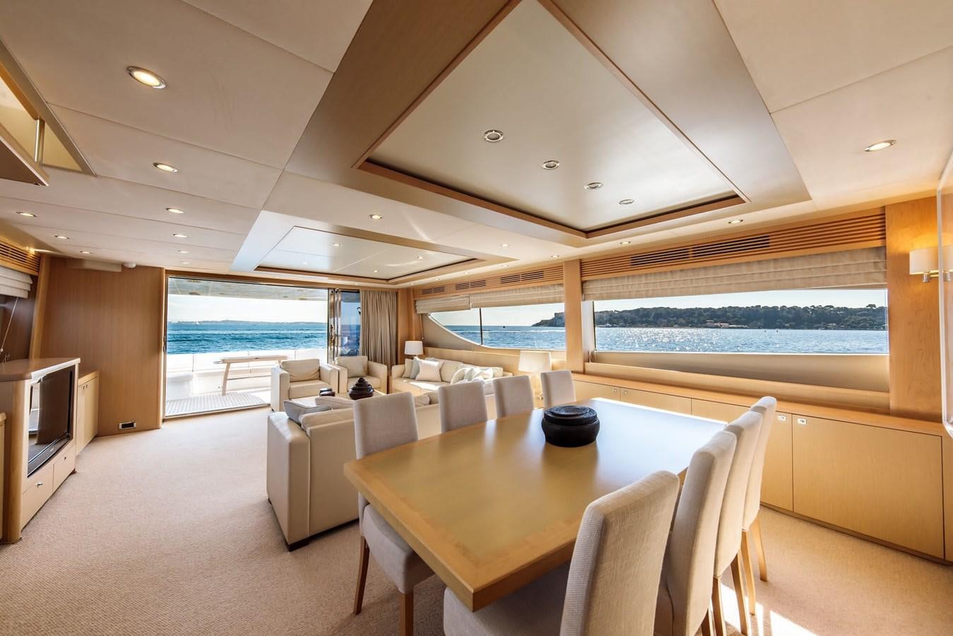 a room with a table and chairs aboard 2009 PRINCESS 85 Yacht for Sale
