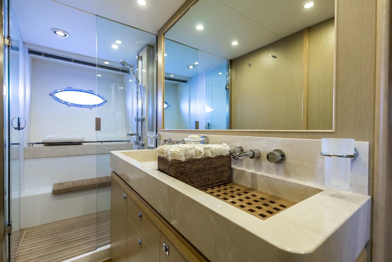 a bathroom with a large mirror aboard 2009 PRINCESS 85 Yacht for Sale