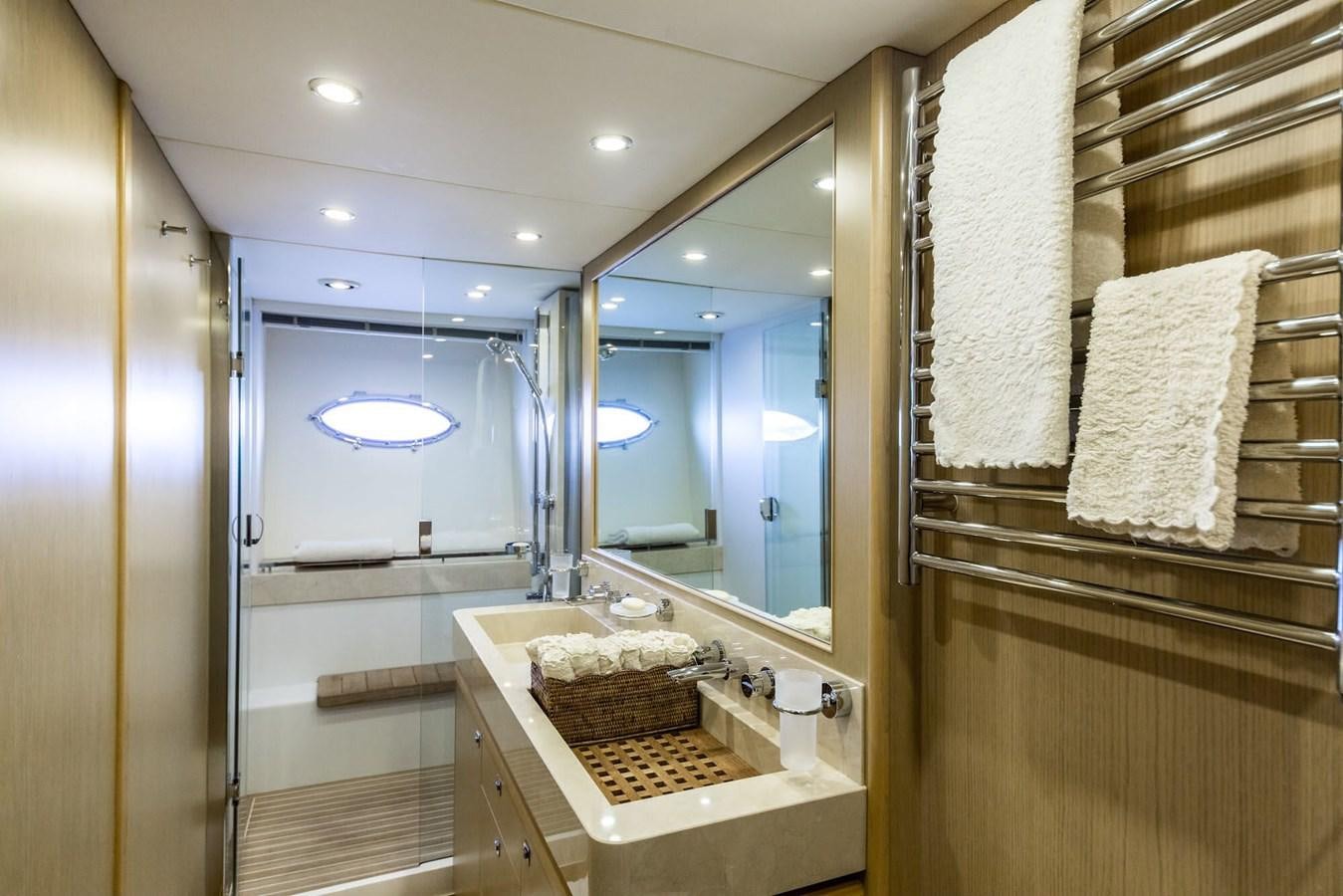 a bathroom with a large mirror aboard 2009 PRINCESS 85 Yacht for Sale