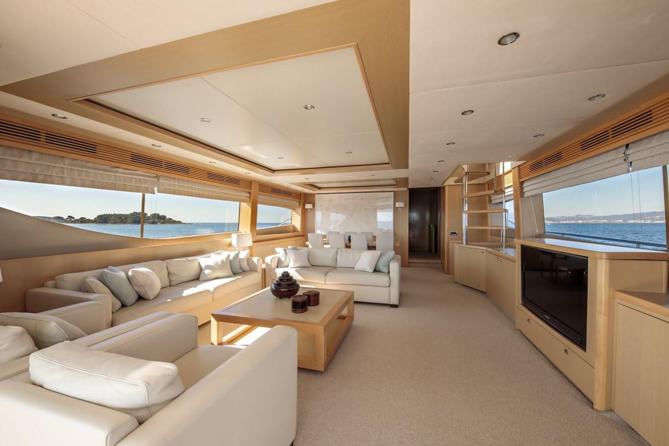a living room with a large window aboard 2009 PRINCESS 85 Yacht for Sale