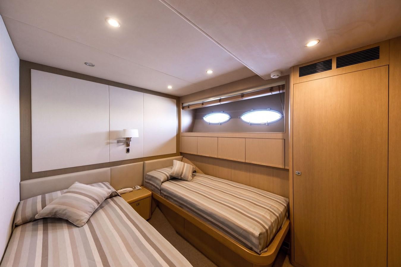 a room with two beds aboard 2009 PRINCESS 85 Yacht for Sale