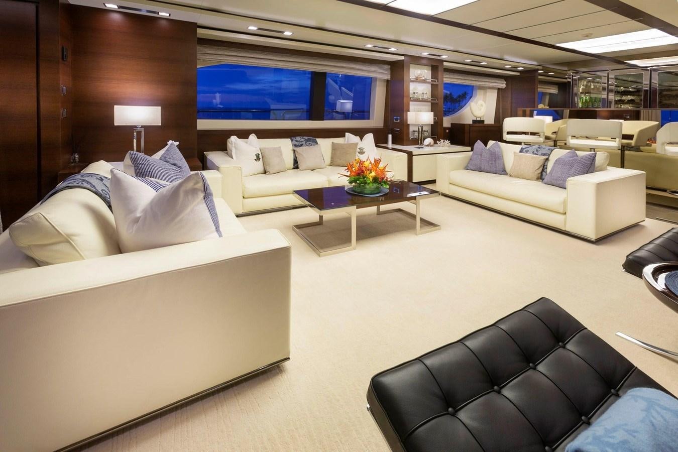 a living room with a couch and a tv aboard INSIEME Yacht for Sale