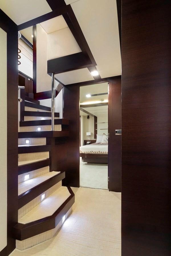 a large wooden stair case aboard INSIEME Yacht for Sale