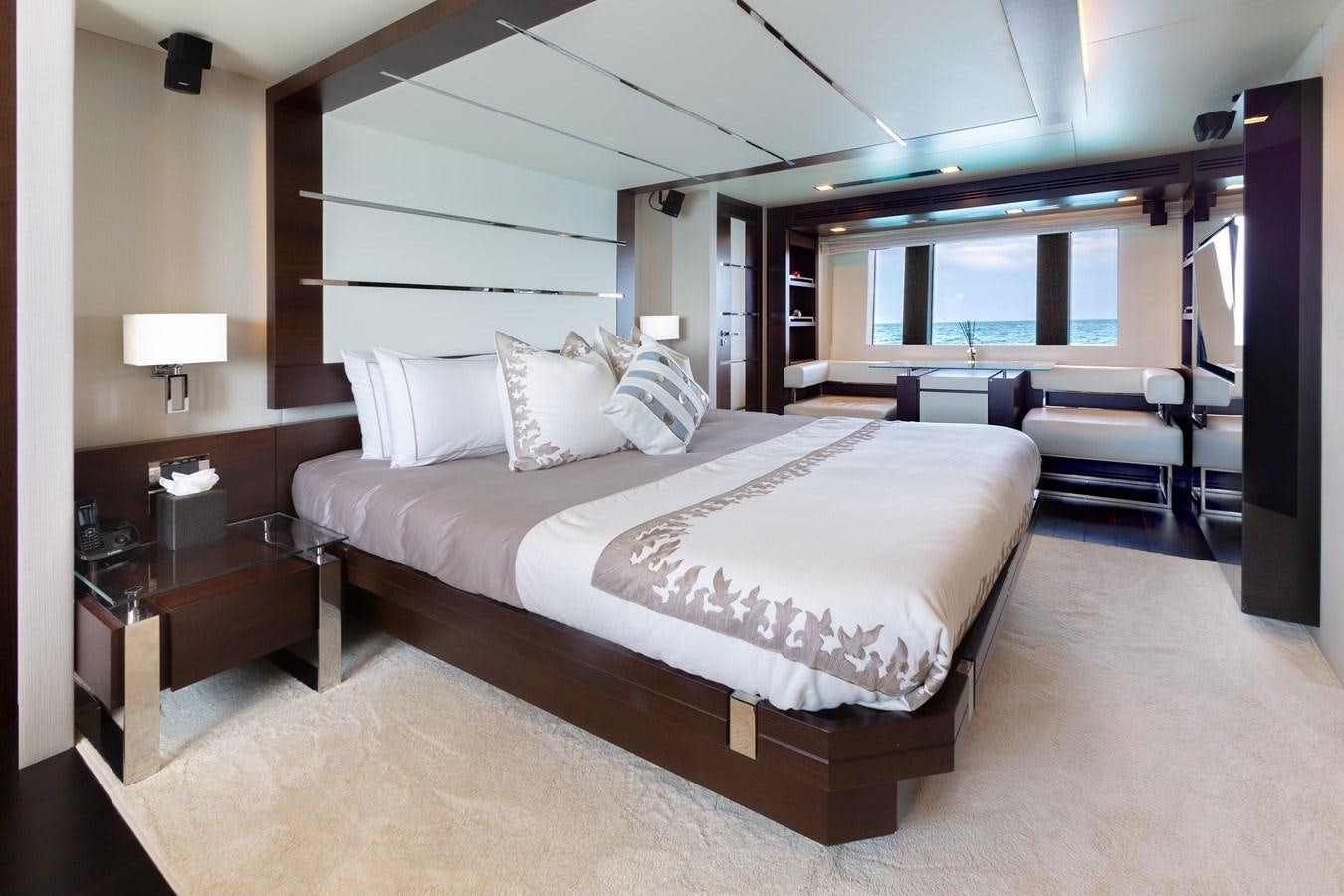a large bed in a room aboard INSIEME Yacht for Sale